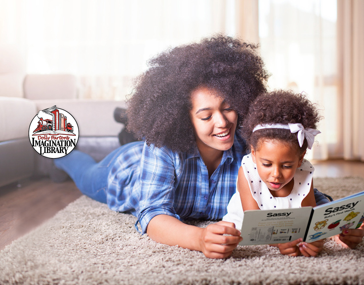 Woman reading picture book with toddler.